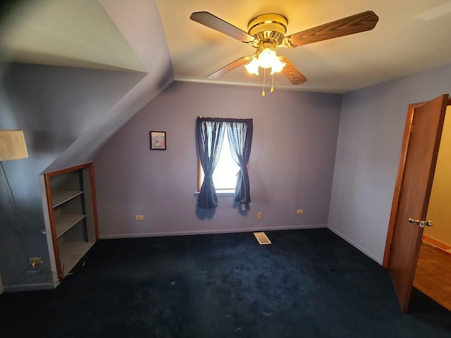 128 Whitehall Ave, Northlake, IL 60164 - additional living space featuring lofted ceiling, dark colored carpet, a ceiling fan, and baseboards