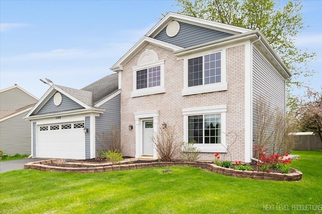 view of front of home featuring brick siding, a garage, a front lawn, and driveway