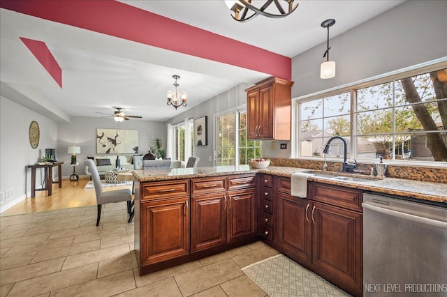 kitchen featuring a sink, dishwasher, ceiling fan with notable chandelier, a peninsula, and pendant lighting