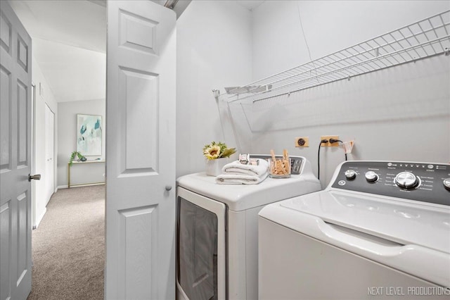 laundry room with laundry area, carpet flooring, and washing machine and dryer