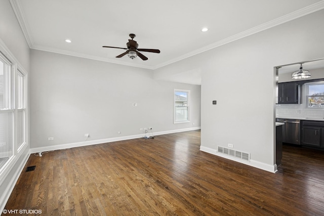 unfurnished living room with plenty of natural light, visible vents, and ceiling fan