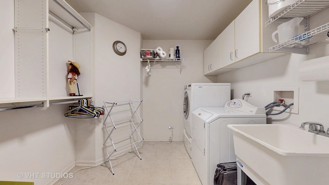 196 Tyler Ct, Lake Zurich, IL 60047 - laundry room with cabinet space, separate washer and dryer, light tile patterned floors, and baseboards