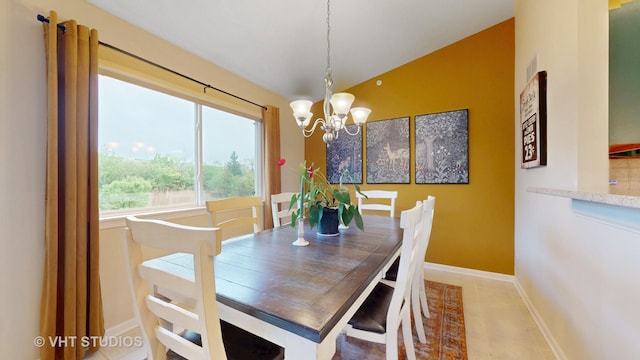 196 Tyler Ct, Lake Zurich, IL 60047 - dining area featuring a chandelier, lofted ceiling, and baseboards