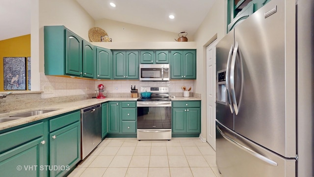 196 Tyler Ct, Lake Zurich, IL 60047 - kitchen featuring stainless steel appliances, vaulted ceiling, backsplash, light tile patterned floors, and a sink