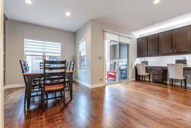 dining area featuring built in desk, dark wood-style floors, and recessed lighting