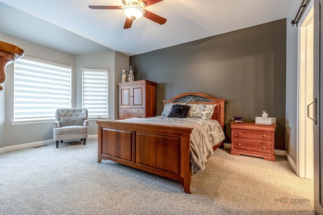 bedroom with baseboards, light colored carpet, and ceiling fan