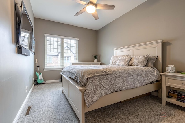 bedroom featuring light carpet, a ceiling fan, visible vents, and baseboards