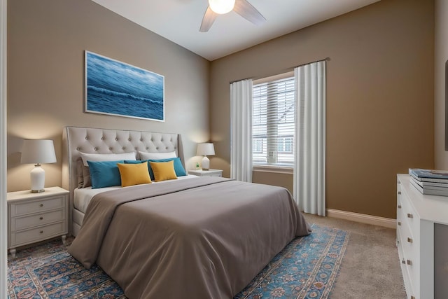 bedroom with carpet floors, a ceiling fan, and baseboards