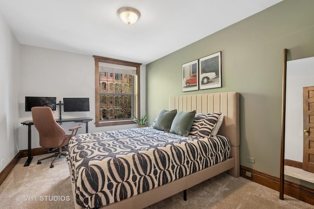 carpeted bedroom with baseboards
