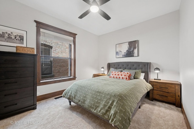 bedroom with a ceiling fan, baseboards, and carpet