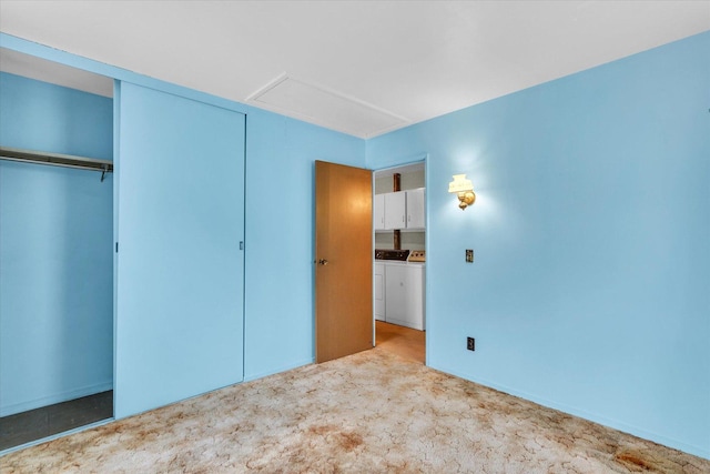 907 E Glenview Dr, Tuscola, IL 61953 - unfurnished bedroom with washer and dryer, attic access, carpet flooring, and a closet
