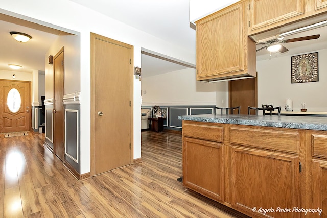 kitchen with light wood-type flooring and a ceiling fan