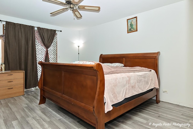 bedroom with light wood-style floors and ceiling fan