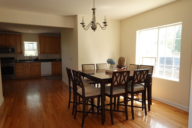 11108 S Myrtle St, Huntley, IL 60142 - dining room with a chandelier, hardwood / wood-style floors, and baseboards