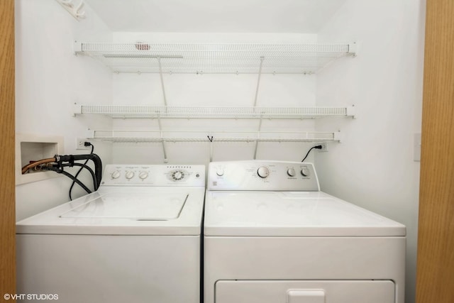 washroom with washing machine and clothes dryer