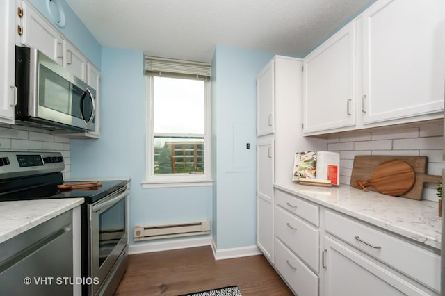 1285 Luther Ln Unit 369B, Arlington Heights, IL 60004 - kitchen with white cabinetry, appliances with stainless steel finishes, a baseboard heating unit, and tasteful backsplash