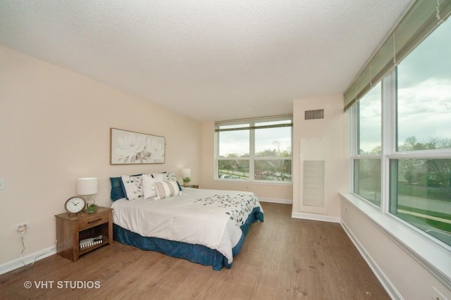 1285 Luther Ln Unit 369B, Arlington Heights, IL 60004 - bedroom with visible vents, baseboards, and wood finished floors
