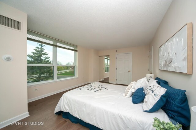 1285 Luther Ln Unit 369B, Arlington Heights, IL 60004 - bedroom featuring baseboards and wood finished floors