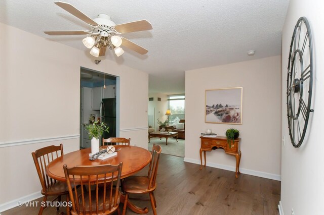 1285 Luther Ln Unit 369B, Arlington Heights, IL 60004 - dining area featuring baseboards, a textured ceiling, ceiling fan, and wood finished floors