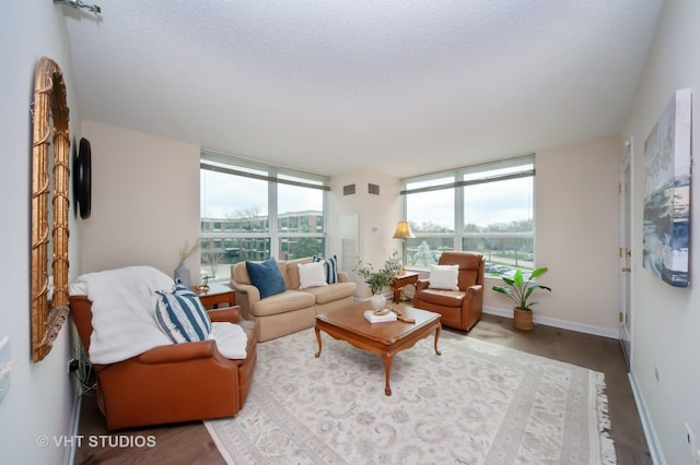 1285 Luther Ln Unit 369B, Arlington Heights, IL 60004 - living room with plenty of natural light, baseboards, wood finished floors, and visible vents