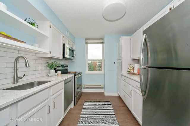 1285 Luther Ln Unit 369B, Arlington Heights, IL 60004 - kitchen featuring open shelves, white cabinets, a sink, appliances with stainless steel finishes, and backsplash