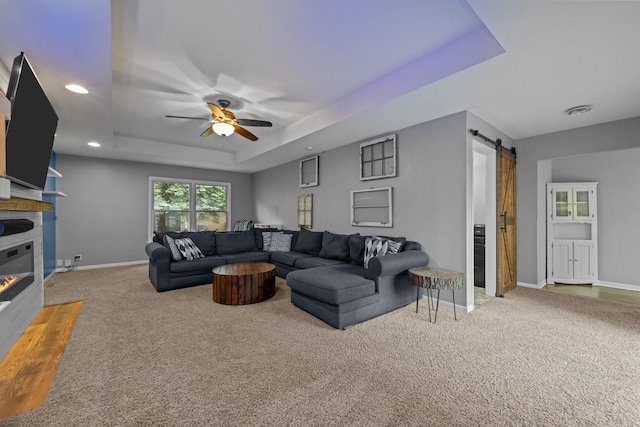 17 S Cypress Dr, Bristol, IL 60512 - carpeted living room with a raised ceiling, a barn door, ceiling fan, baseboards, and recessed lighting