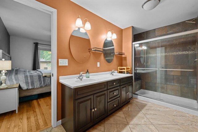 17 S Cypress Dr, Bristol, IL 60512 - full bathroom with double vanity, connected bathroom, and a shower stall