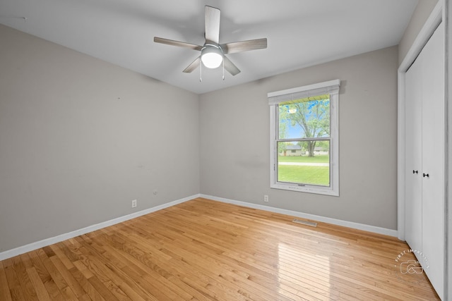 17 S Cypress Dr, Bristol, IL 60512 - unfurnished bedroom featuring light wood-type flooring, a closet, baseboards, and ceiling fan