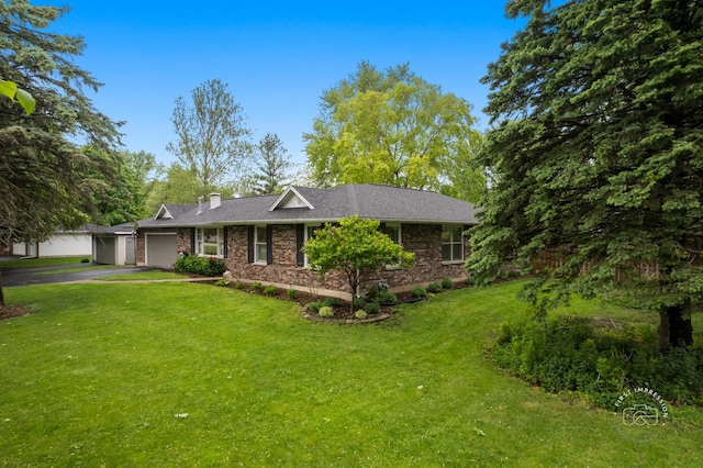 17 S Cypress Dr, Bristol, IL 60512 - ranch-style home with an attached garage, driveway, a front yard, and brick siding