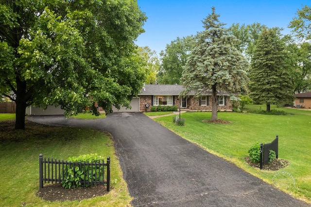 17 S Cypress Dr, Bristol, IL 60512 - view of front of house featuring driveway and brick siding