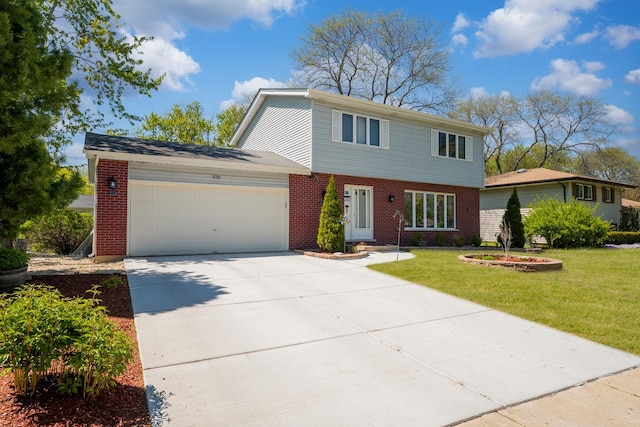 colonial inspired home featuring brick siding, a garage, concrete driveway, and a front lawn