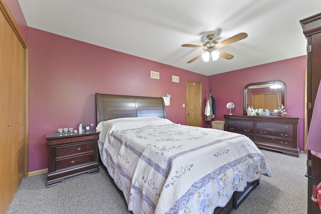 bedroom with carpet, a closet, and ceiling fan