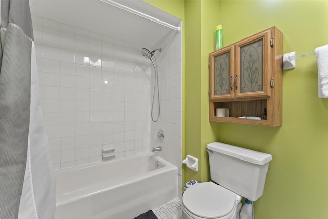 bathroom with shower / tub combo and toilet
