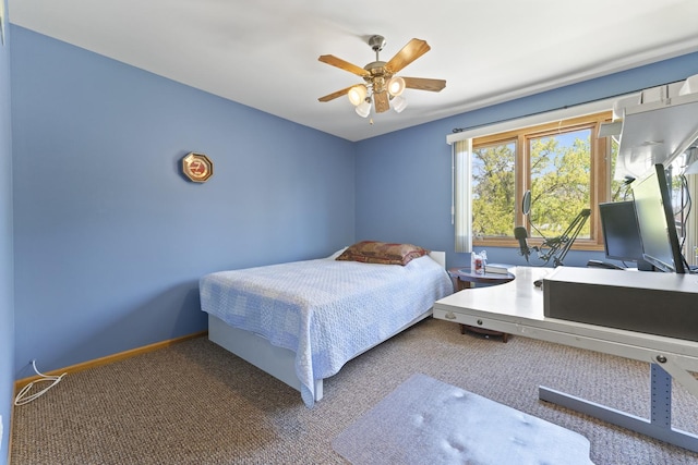 bedroom with carpet flooring, a ceiling fan, and baseboards