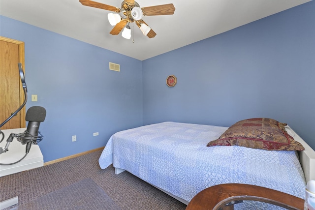 carpeted bedroom with baseboards and a ceiling fan