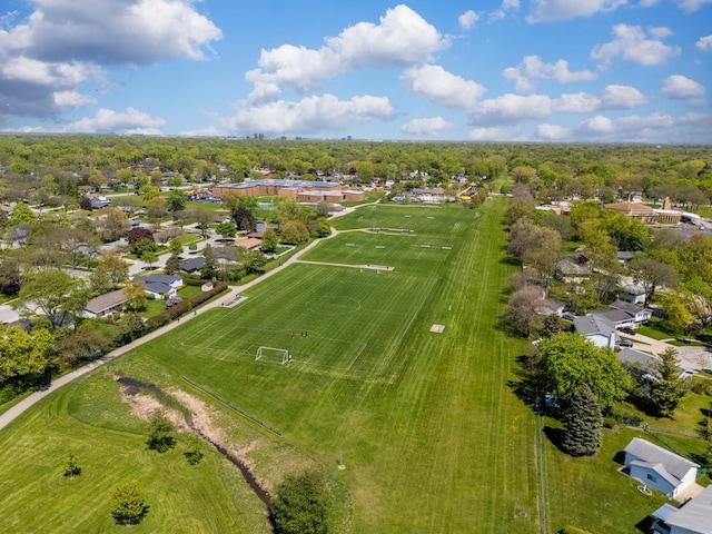 aerial view of property and surrounding area with nearby suburban area