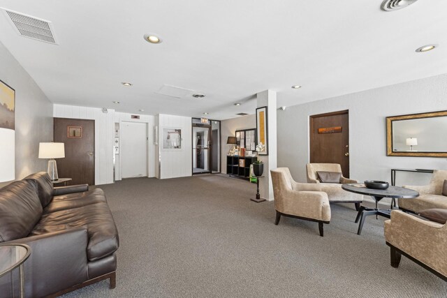 living room featuring visible vents, recessed lighting, and carpet floors