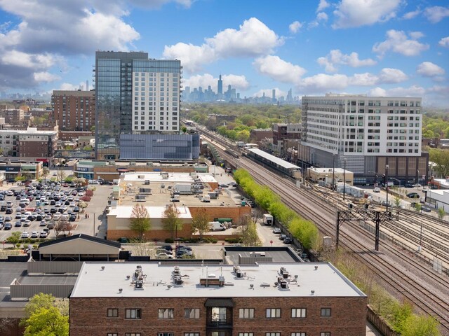 birds eye view of property with a city view