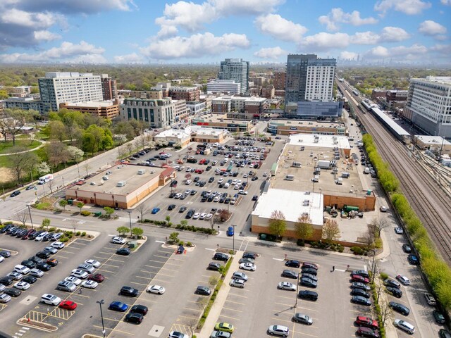 birds eye view of property featuring a city view