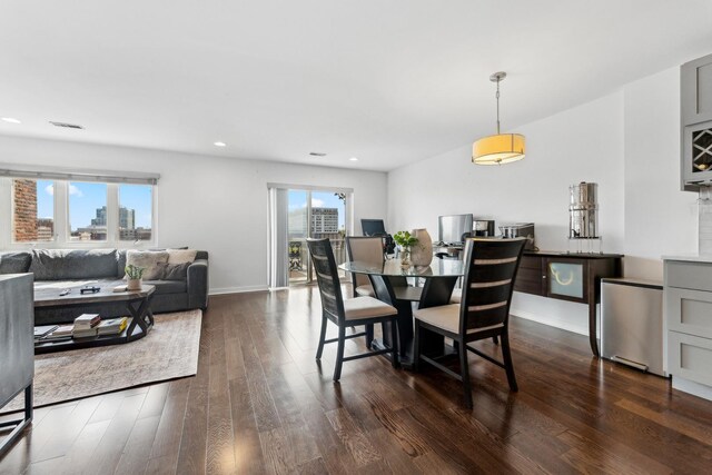 dining room featuring recessed lighting, baseboards, and dark wood-style floors