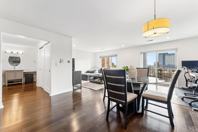 dining space featuring recessed lighting and wood finished floors