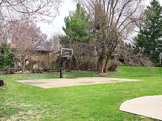 view of sport court with community basketball court and a lawn