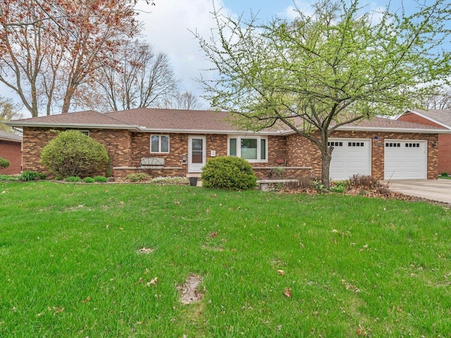 ranch-style home with brick siding, a garage, a front yard, and concrete driveway