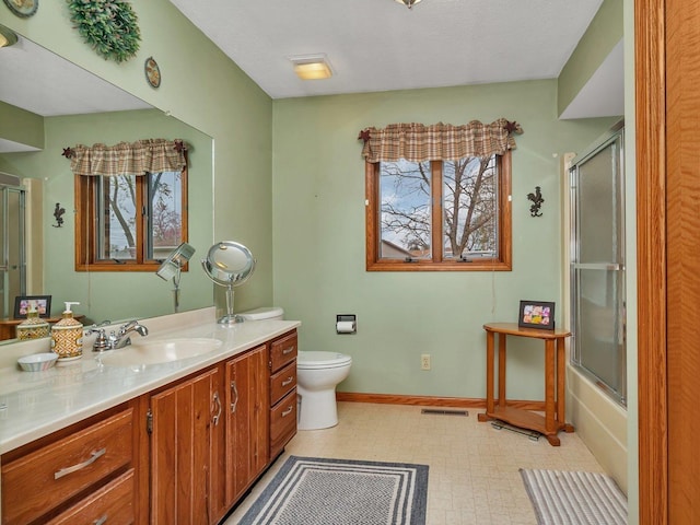 full bath with tile patterned floors, toilet, visible vents, baseboards, and vanity