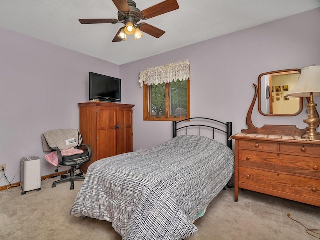 bedroom featuring ceiling fan, baseboards, and carpet flooring