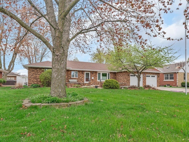 single story home featuring brick siding, driveway, a front lawn, and a garage