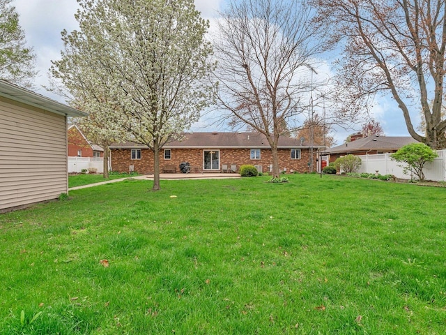 view of yard featuring a patio area and fence