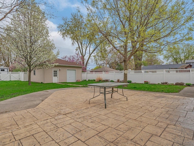 view of patio / terrace featuring a fenced backyard, an outdoor structure, and outdoor dining space