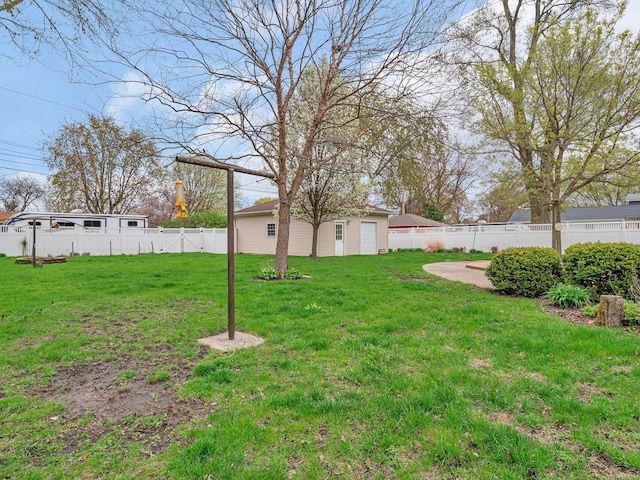 view of yard with a fenced backyard and an outdoor structure