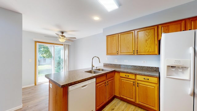 341 Capitol Dr Unit D, Sugar Grove, IL 60554 - kitchen featuring white appliances, a peninsula, light wood finished floors, a ceiling fan, and brown cabinetry